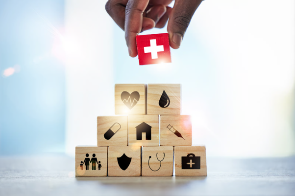 Healthcare and protection symbols representing SME health insurance for employers and their workforce.