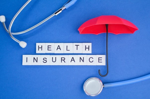 What does private health insurance cover in the UK, represented by health insurance, a stethoscope and medical care.